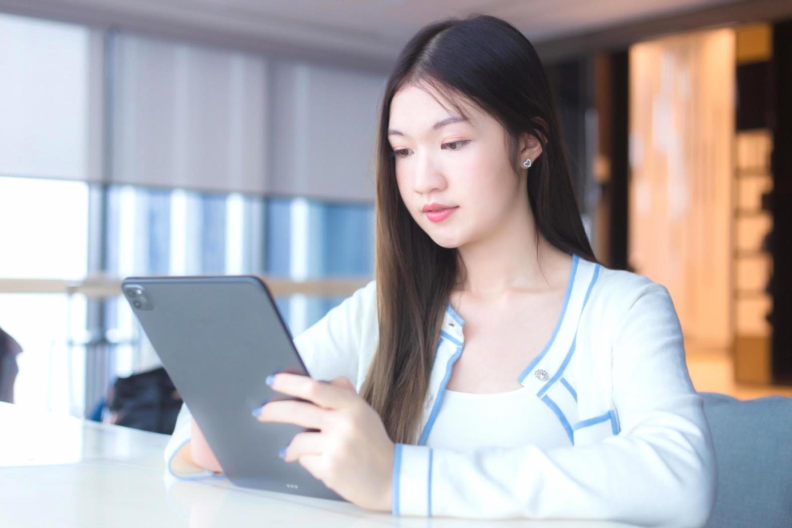 Students working on investment automation strategies in a modern learning environment