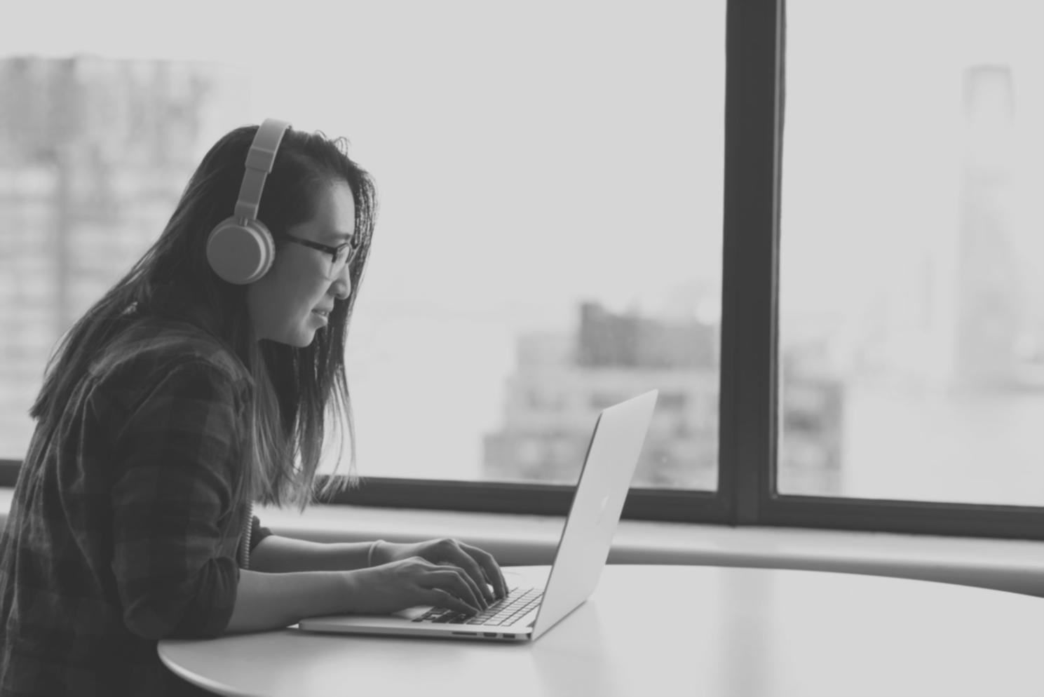 Professional consultation meeting with investment charts and educational materials spread on a modern conference table